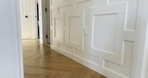 hallway makeover with trim pattern on lower half painted white