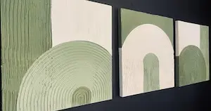 three diy texture paintings made using joint compund and tile adhesive