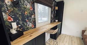 DIY built in wood desk top with ikea brimnes cabinets and custom black bookcases