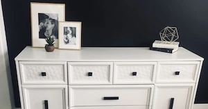 old wood dresser refinished with white paint and black hardware