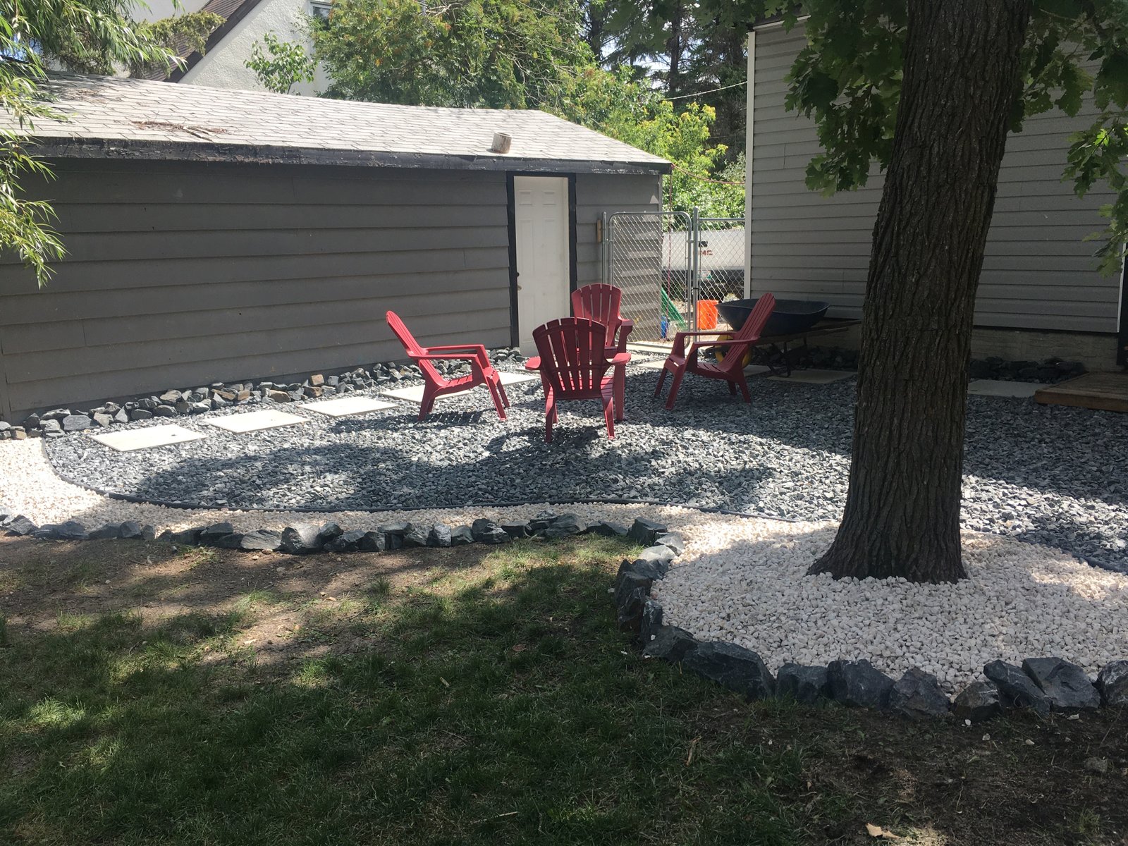 new loose material patio using black granite and limestone