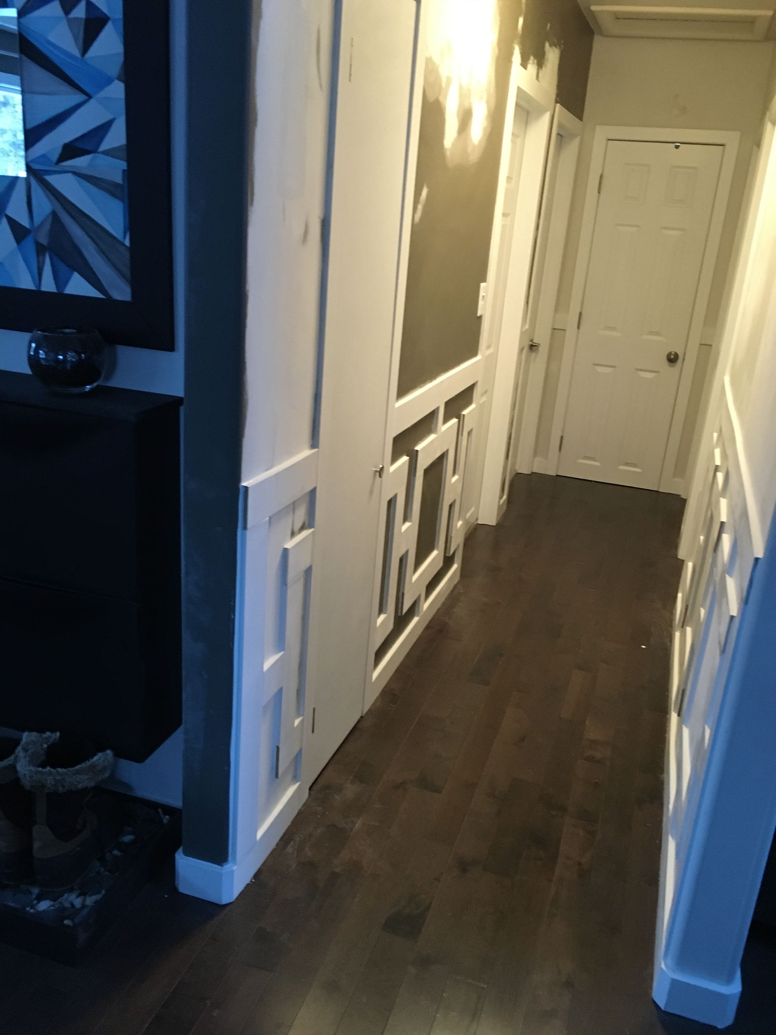 hallway when baseboard trim is being added to the lower half of the walls