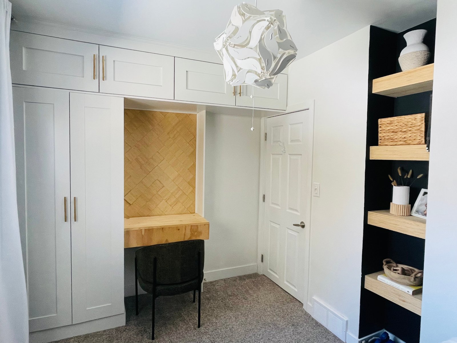 built-in-wardrobe wall with small built in desk and herringbone wood feature
