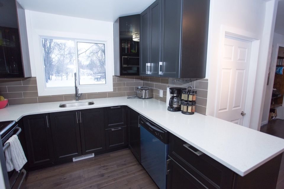 black ikea kitchen with grey backsplash before makeover