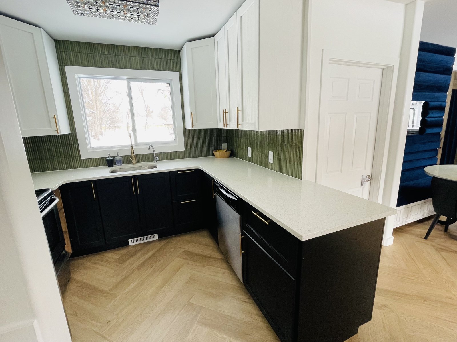 ikea kitchen makeover on a budget with black lower cabinets and white uppers