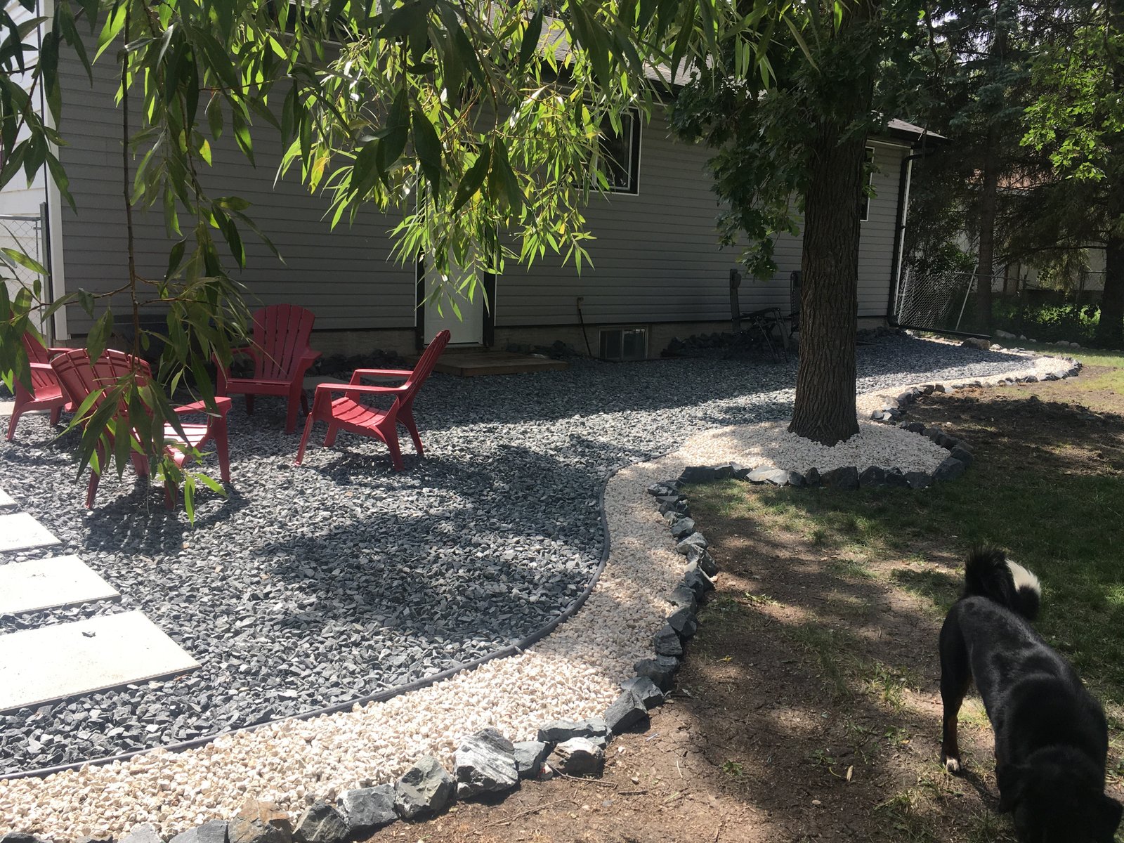 large black and white gravel patio done in one day on a budget