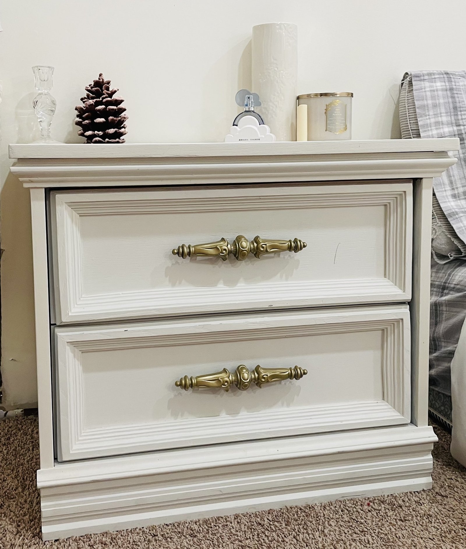 old two drawer nightstand refinished with white paint and gold pulls