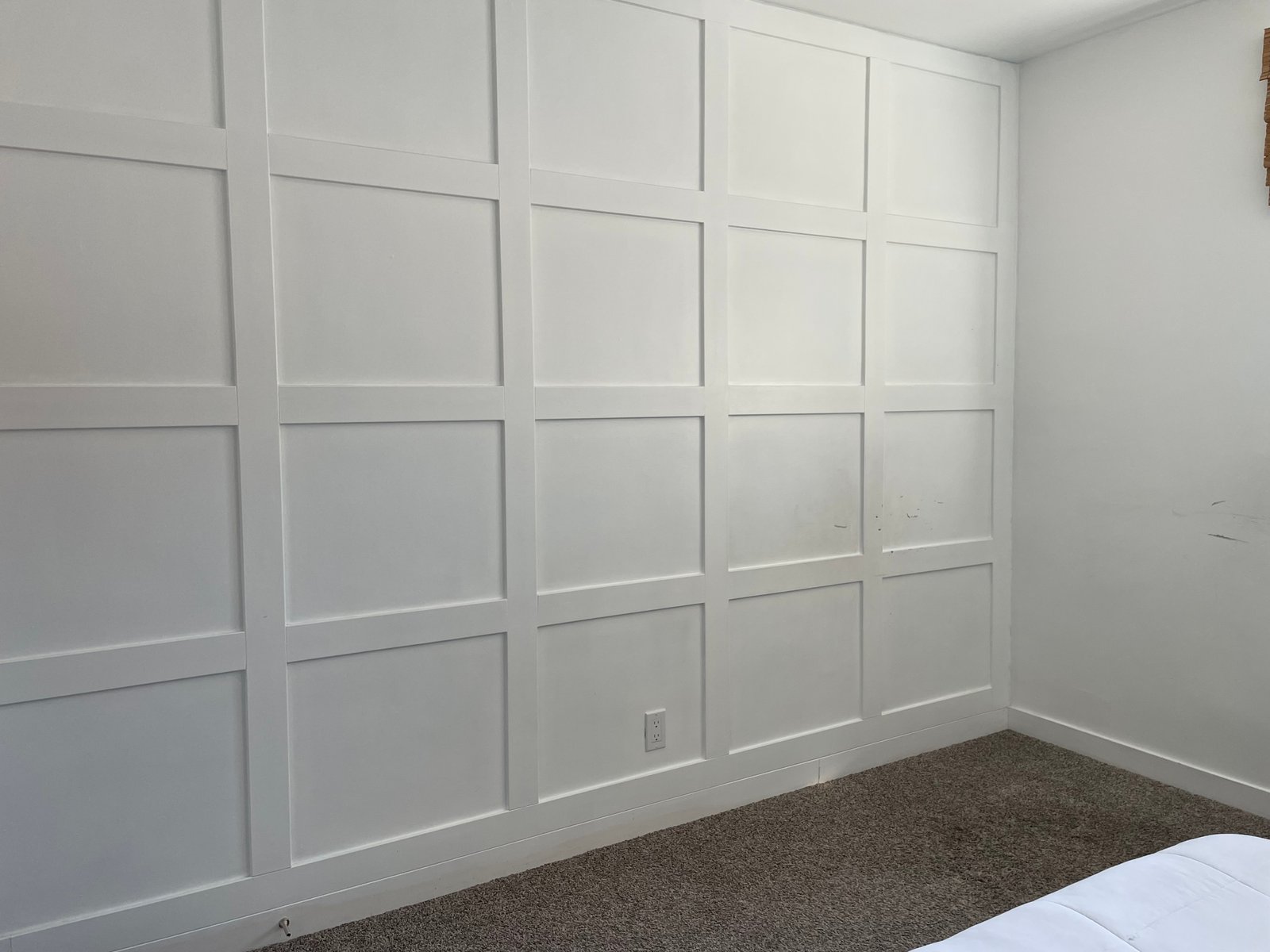 white board and batten bedroom feature wall