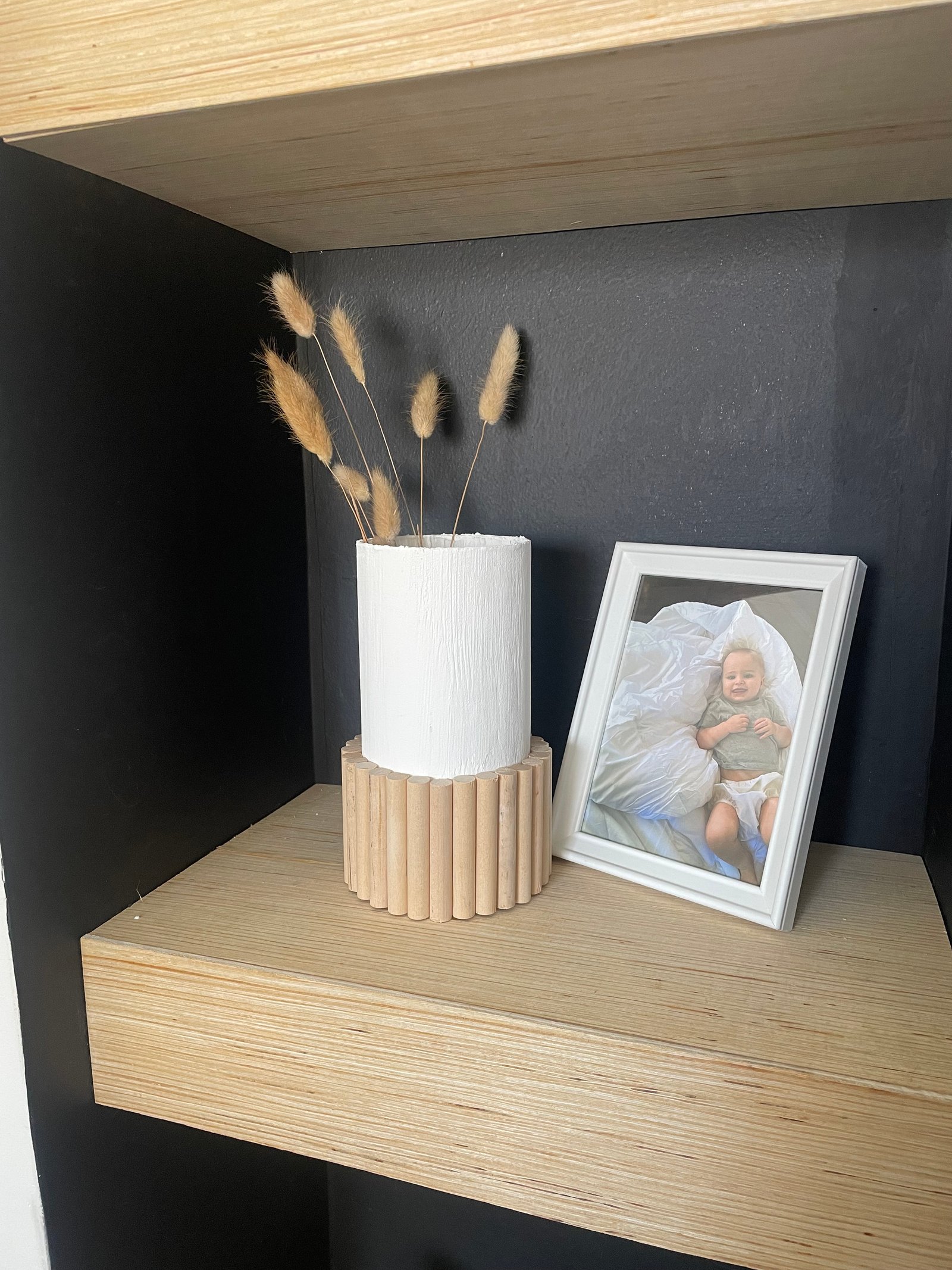 white texture painted vase with wood dowels